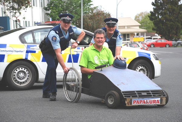 Constable PJ McNab, Councillor Peter Jones (in trolley) and Constable Matt Green.